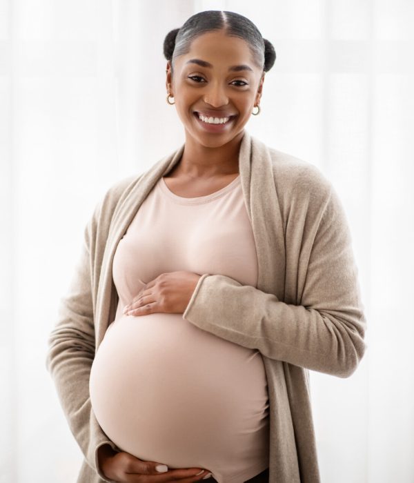 Pregnant black woman showing her baby sonography- Clover Hospital and Fertility Clinic1